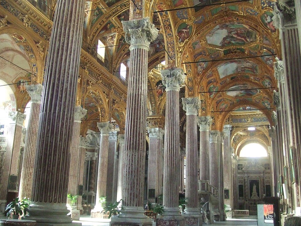 Columns and painted vaults along the nave of the Annunziata