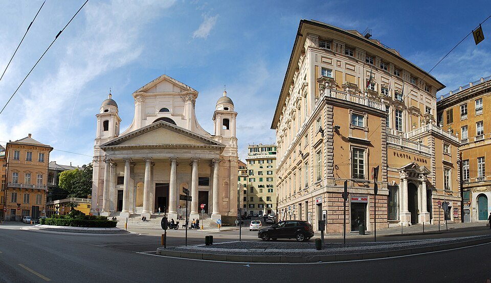 A church front and office blocks where the modern street runs past the old town