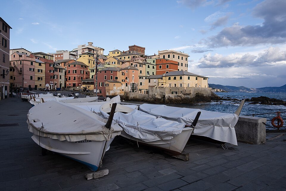 Boats hauled up on the pebbles at Boccadasse, covered against the weather