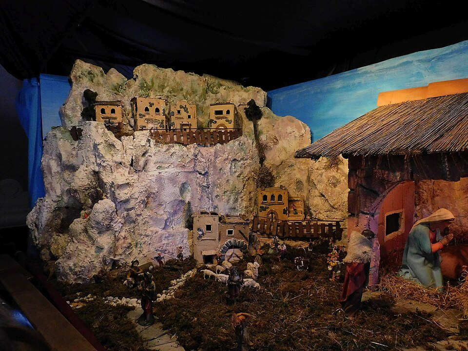 A Genoese nativity scene with figures set in a painted landscape