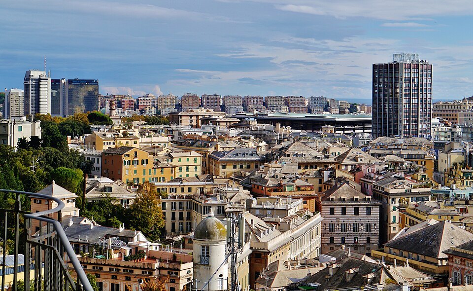 The city from the Montaldo belvedere, tiled roofs running out toward the towers