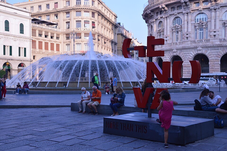 The fountain of Piazza De Ferrari with the GENOVA letters and the theatre behind