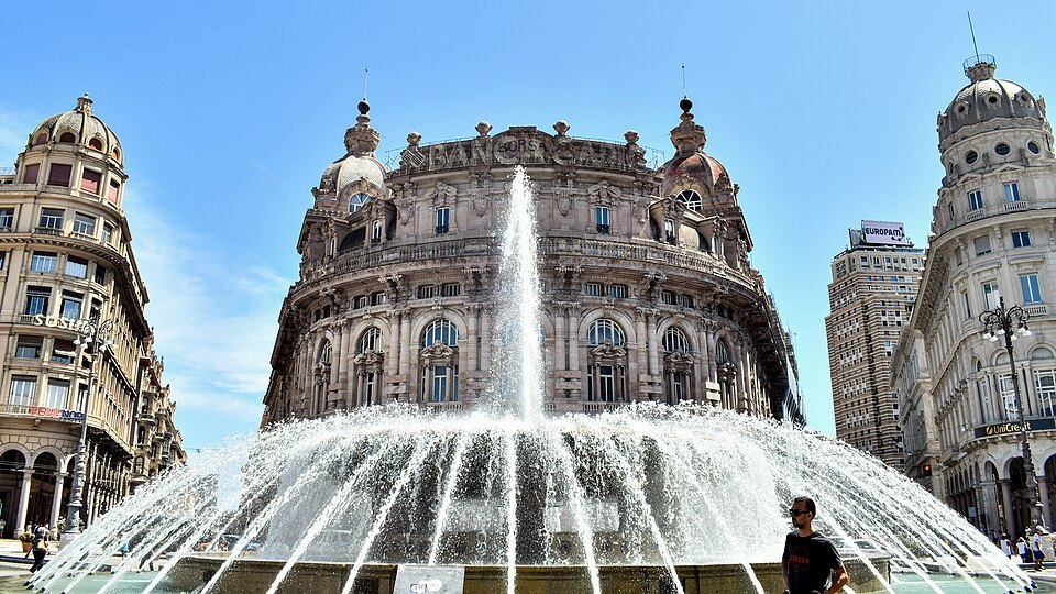 The bronze fountain of Piazza De Ferrari in front of the domed former stock exchange