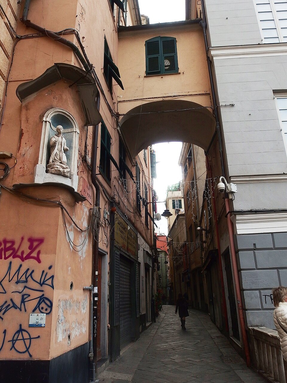 Via di Prè, a long narrow lane with an arch across it