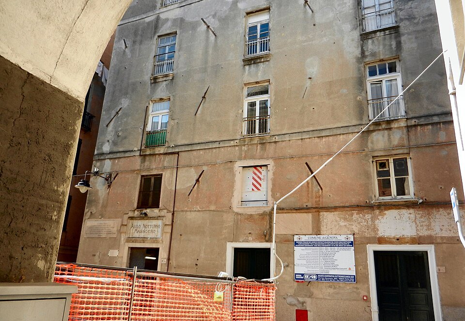 A building in the Maddalena quarter under repair, its plaster stripped