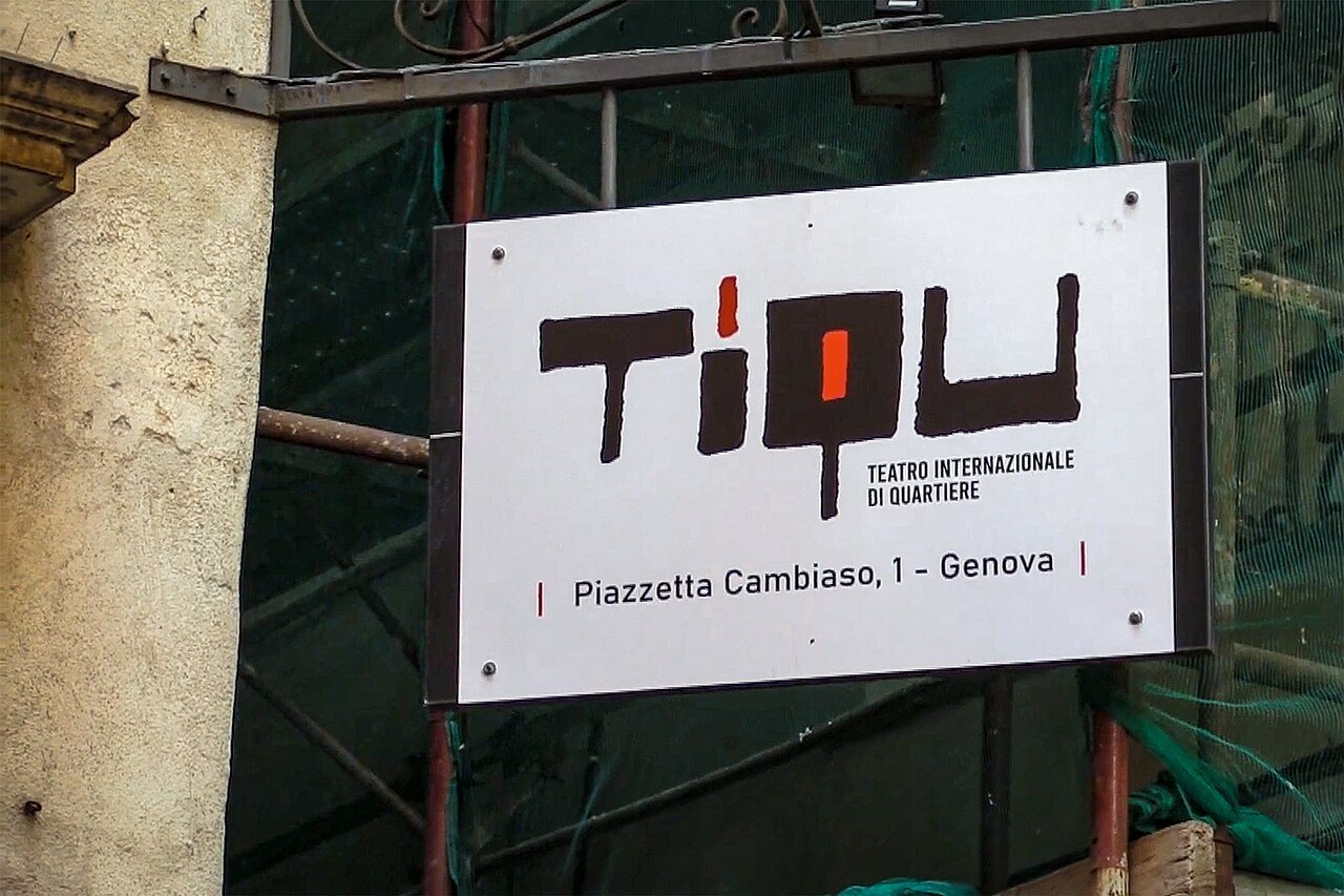 A theatre sign in a lane of the old town, on scaffolding