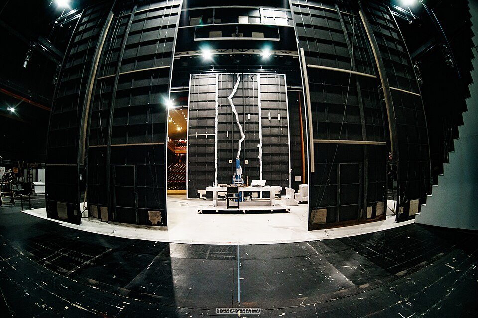 The bare stage of the Carlo Felice seen from the stalls