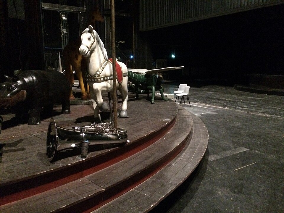 Scenery and a stage horse in the wings of the Teatro Carlo Felice