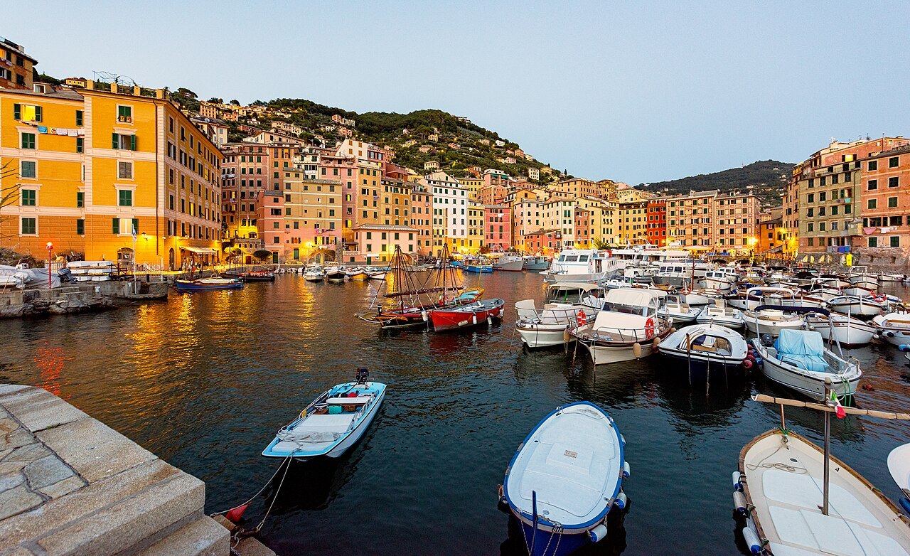 Boats in the harbour at Camogli under the tall painted houses