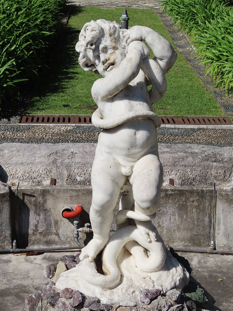 A marble putto in the garden of Palazzo Podestà