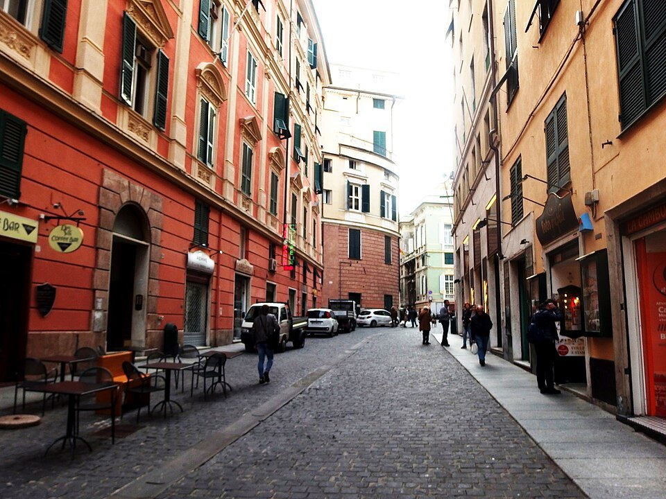 Via Cairoli, a straight palace street with cafés under the fronts
