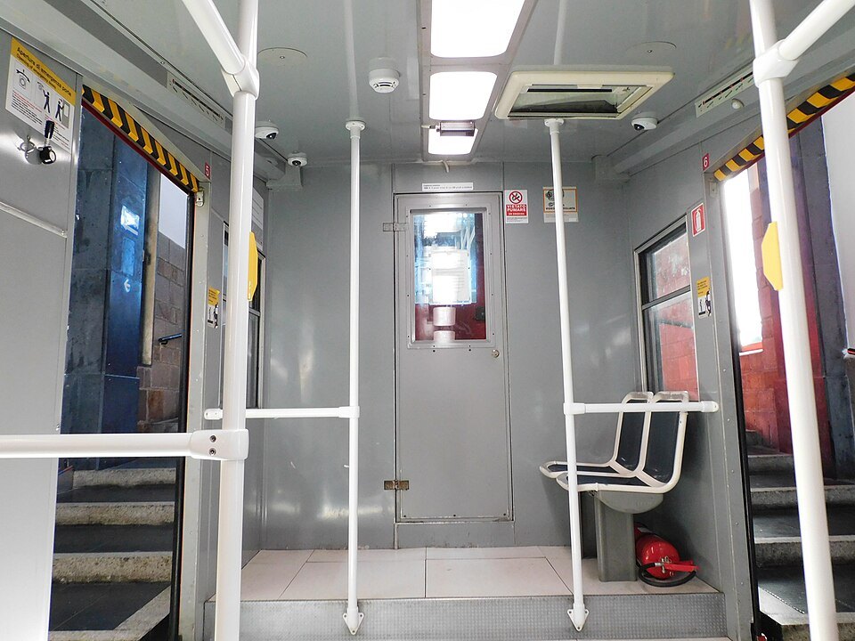 The interior of a Zecca–Righi funicular car, benches stepped to the slope