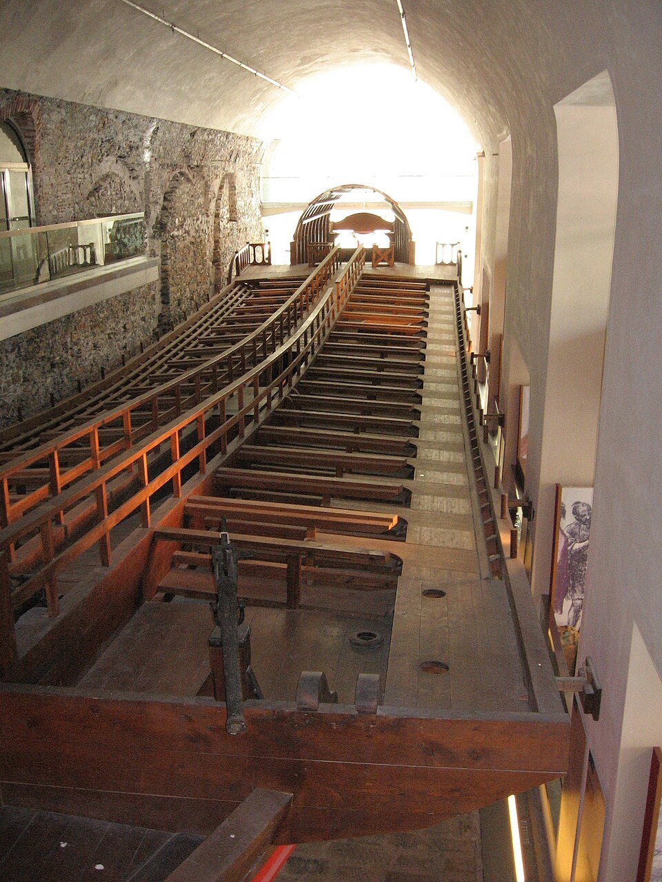The full-size galley reconstruction inside the museum, seen along the oars