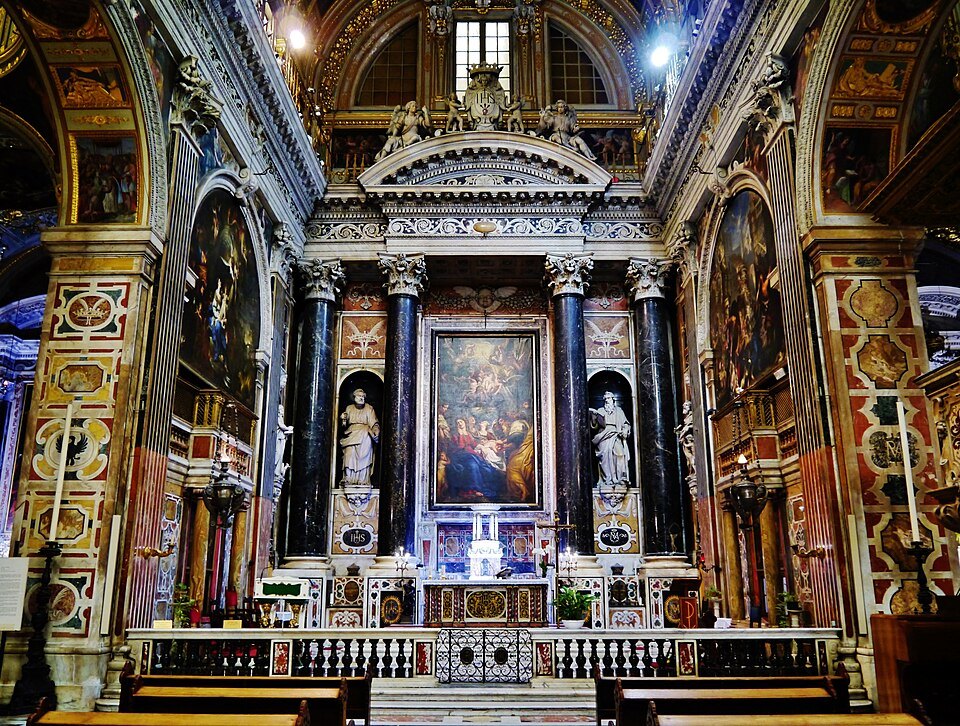 A side altar of the Gesù, its altarpiece framed in marble and gold