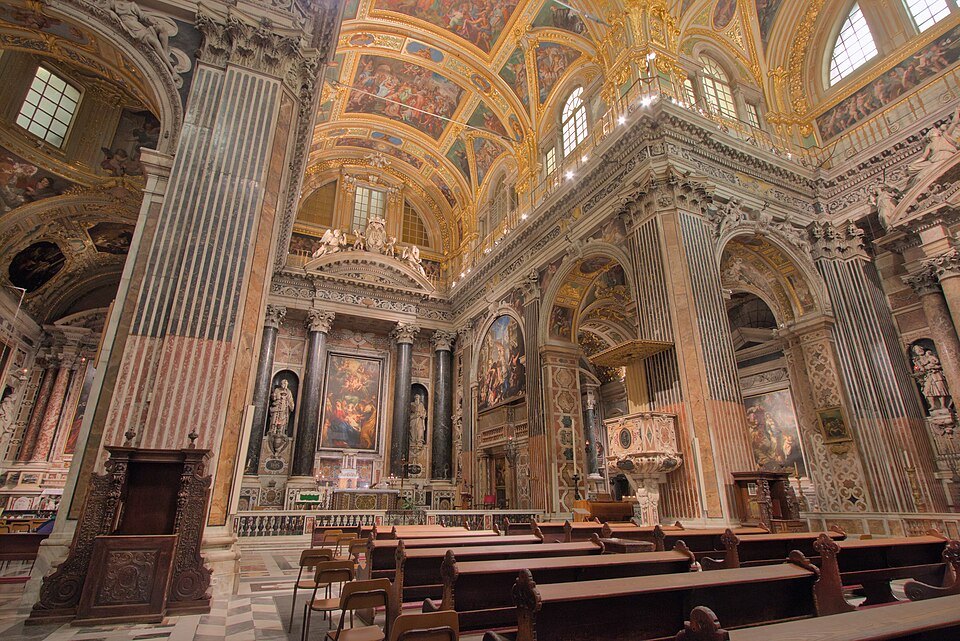 The Gesù's marble piers and gilded chapels along the nave