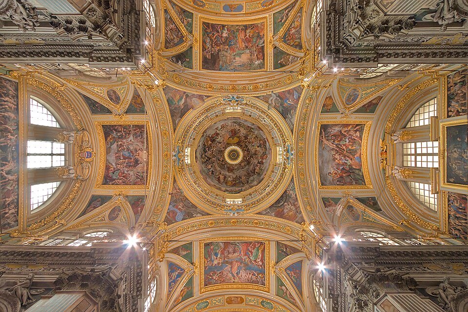 The vaults of the Gesù, gilded stucco framing the painted scenes