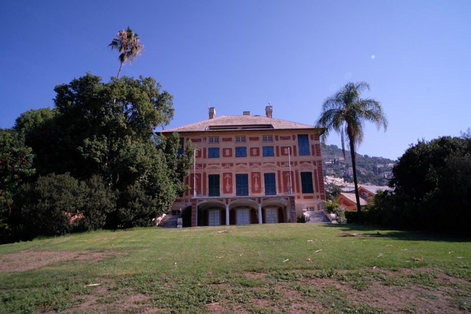 The pink villa in the Nervi parks, palms standing over the lawn