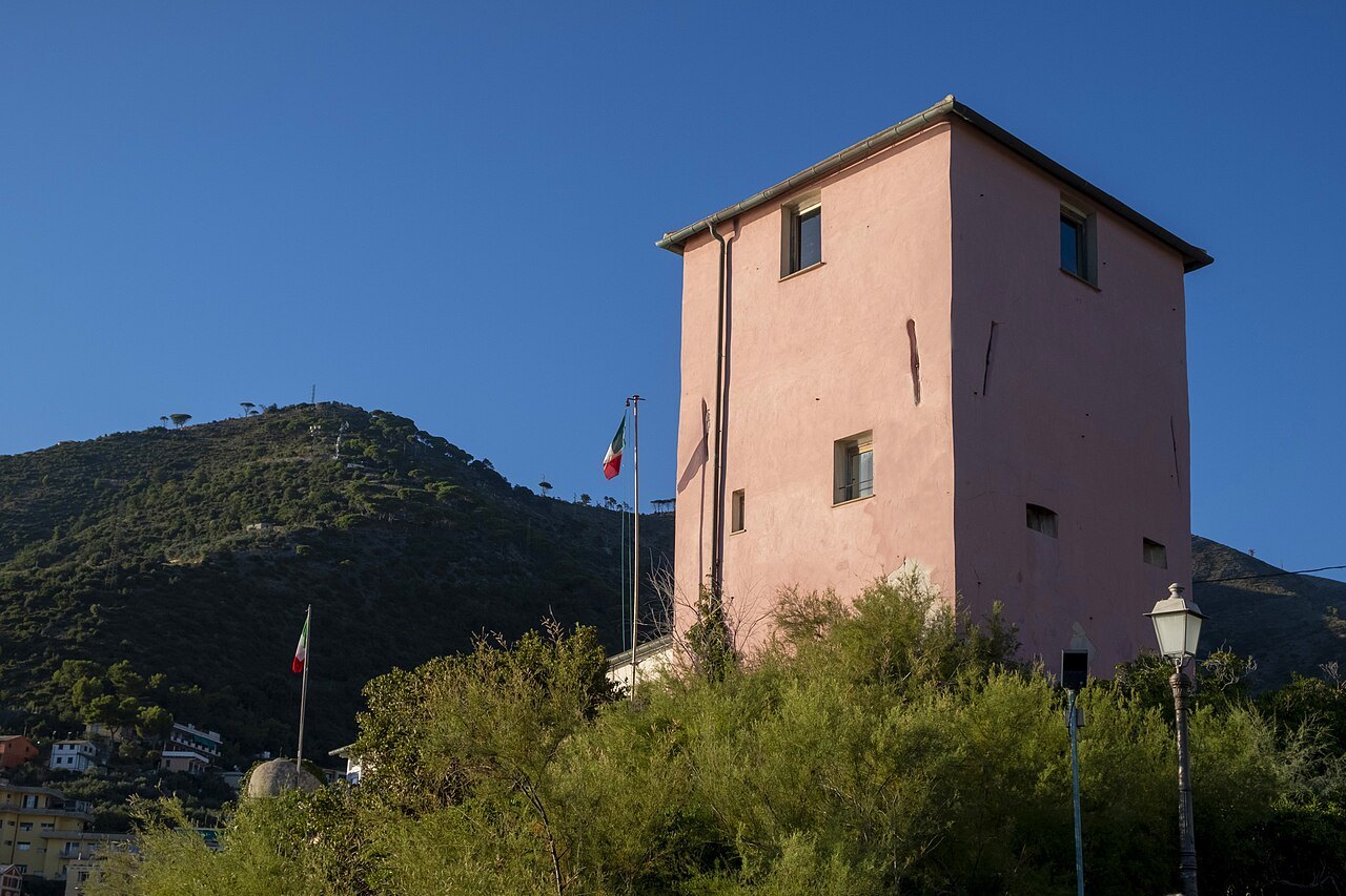 The castle at Nervi above the shore, flying the Italian flag