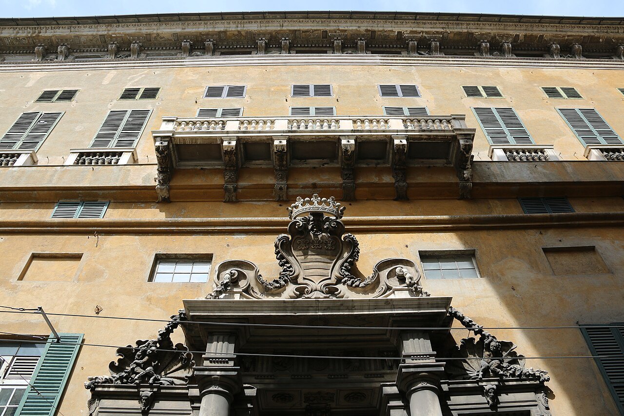 The stone doorcase of a palace on Via Garibaldi, seen from the street