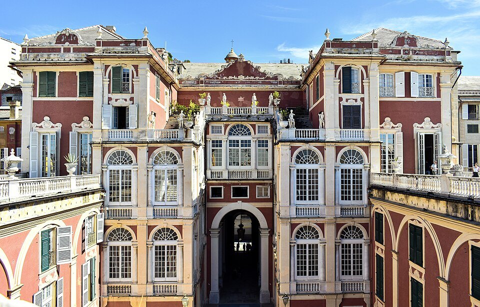 The red and cream courtyard front of the Palazzo Reale on Via Balbi