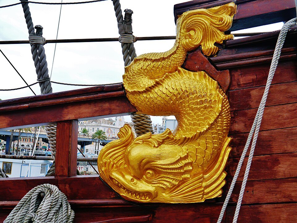 The gilded dolphin figurehead of the Neptune galleon at the old port