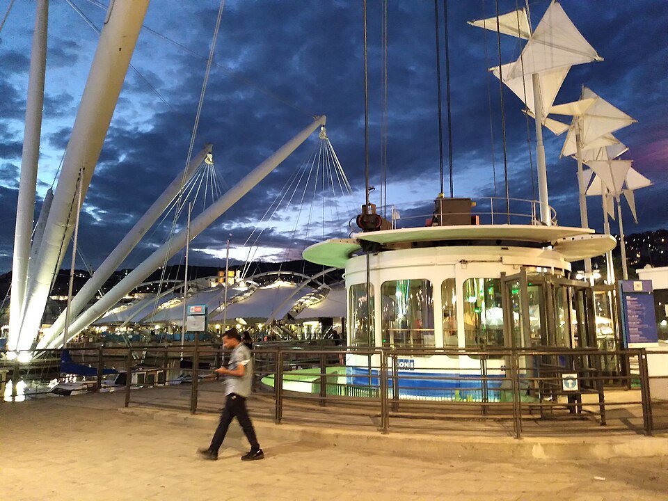 The Bigo at dusk, its cables and white arms lit against the sky