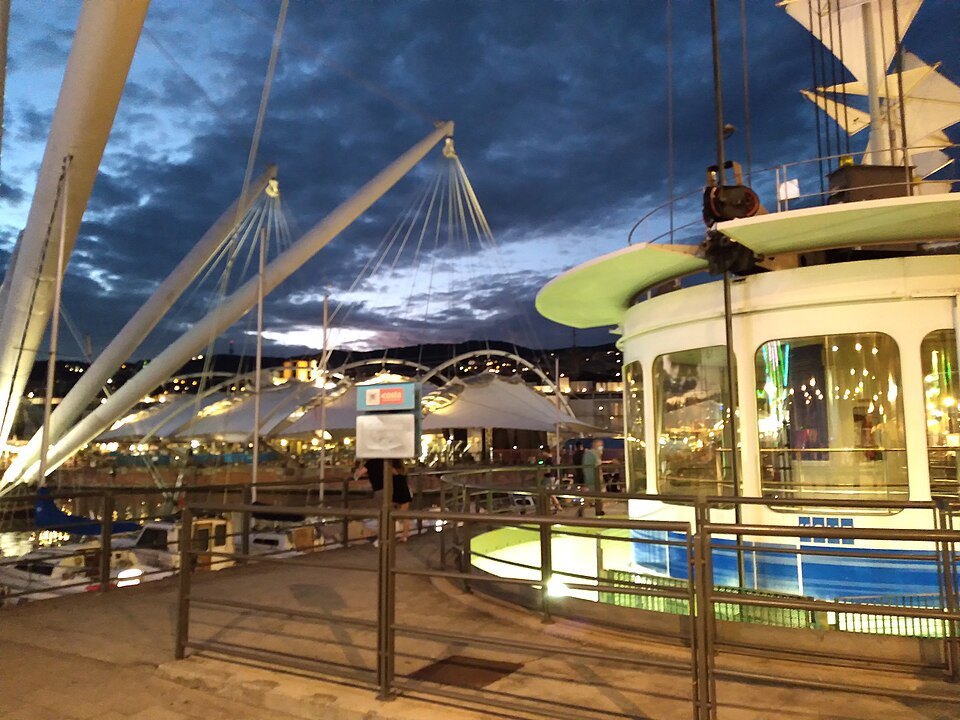 The Bigo's cabin and mast from below, the shops of the quay behind