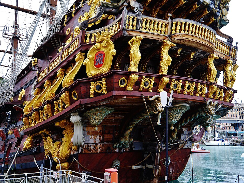 The stern of the Neptune, carved and gilded above the water
