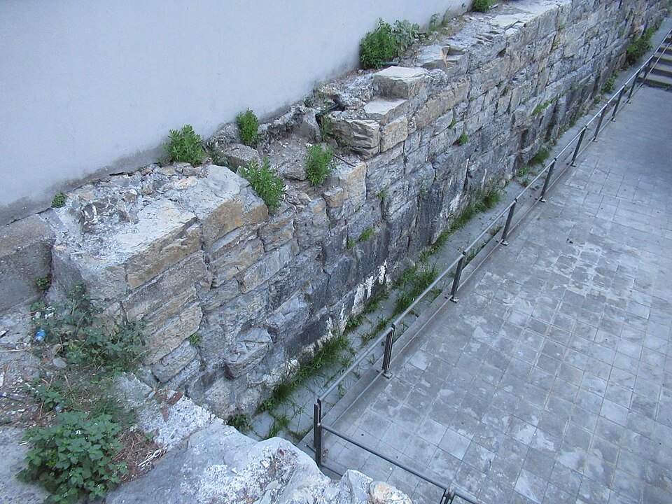 Stone of the old Molo walls at Piazza Caricamento, cut and weathered