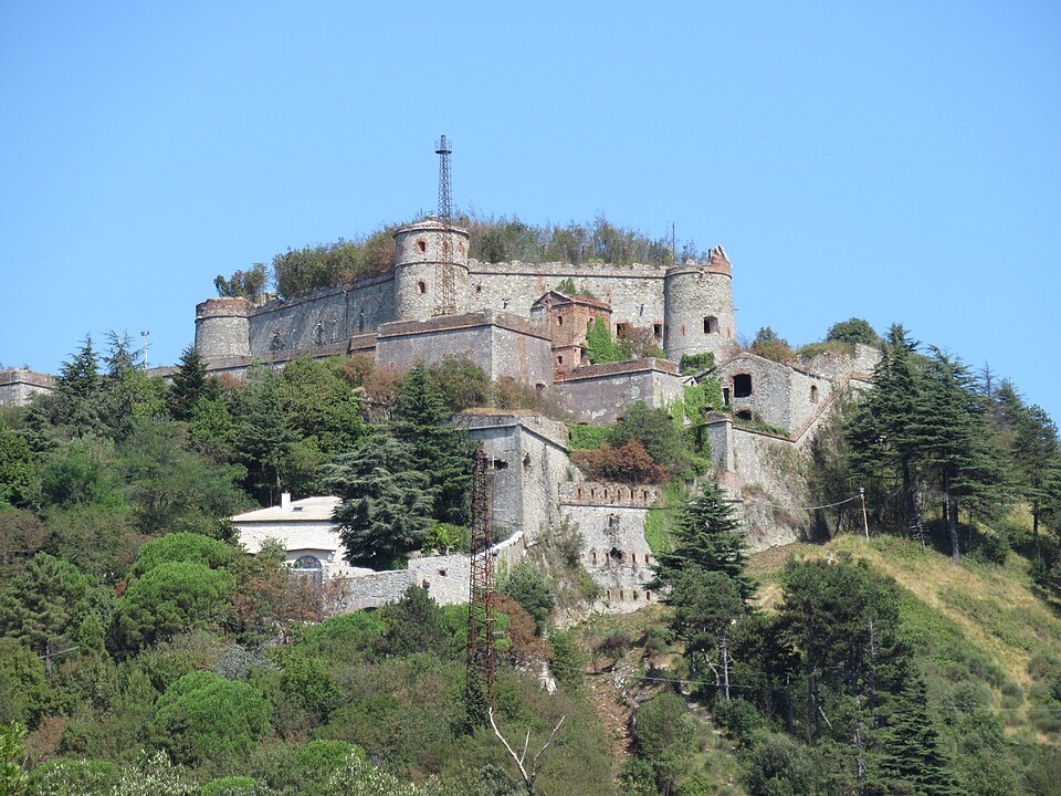Forte Sperone from the ridge path, its ramparts stepped into the slope
