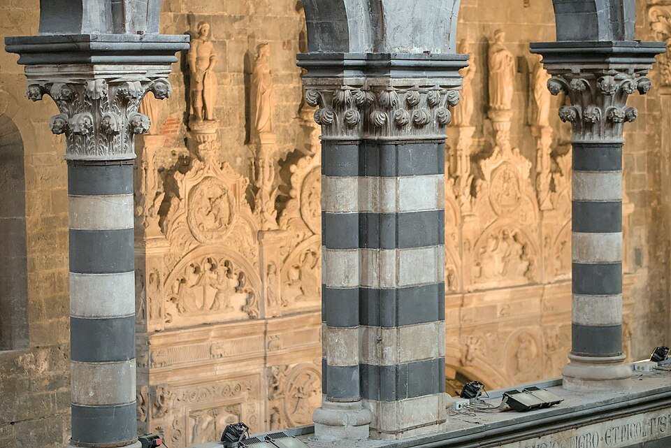 Striped columns and carved capitals inside San Lorenzo