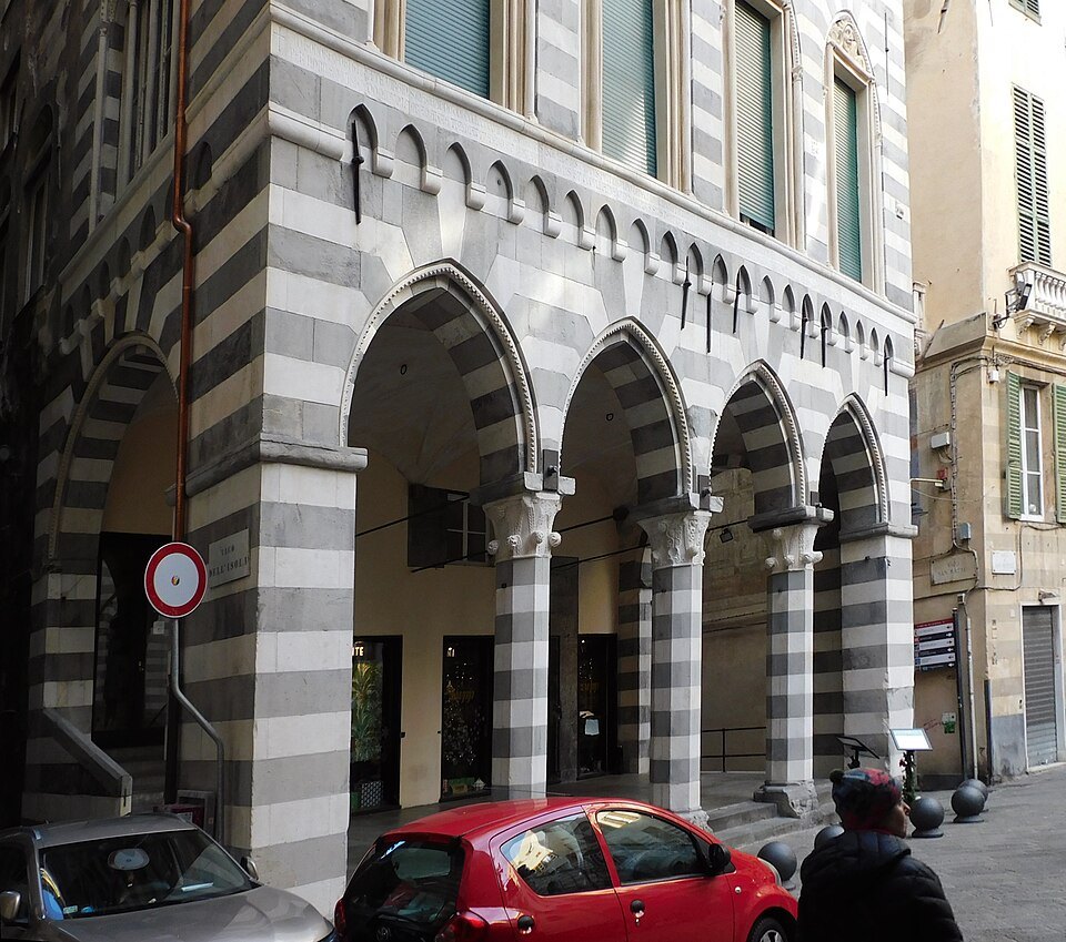 The banded portico of Palazzo Doria Lamba, its arches open to the street