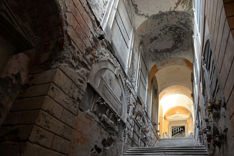 A corridor of tombs at Staglieno, the arcade stepping up the hillside