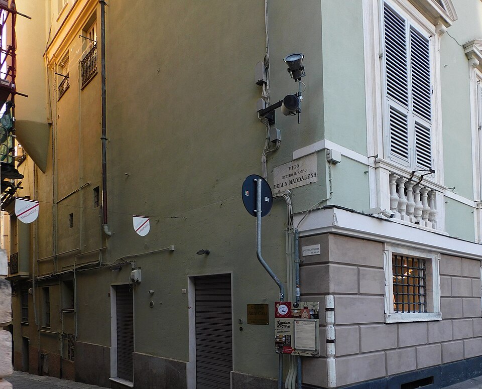 A lane behind Via Garibaldi, plain walls and shuttered windows